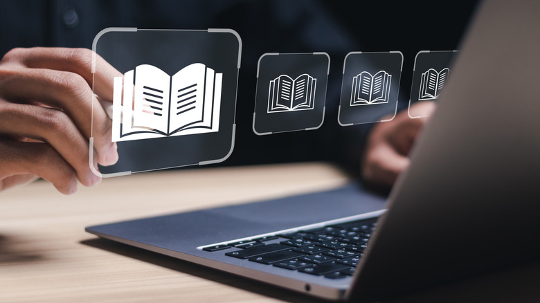 책 아이콘이 맥북 위에 떠 다니고 있습니다