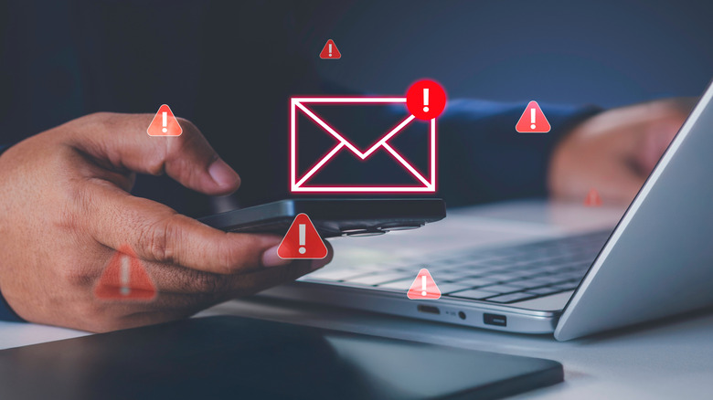 빨간색 경고 아이콘이 있는 이메일을 클릭하는 사람