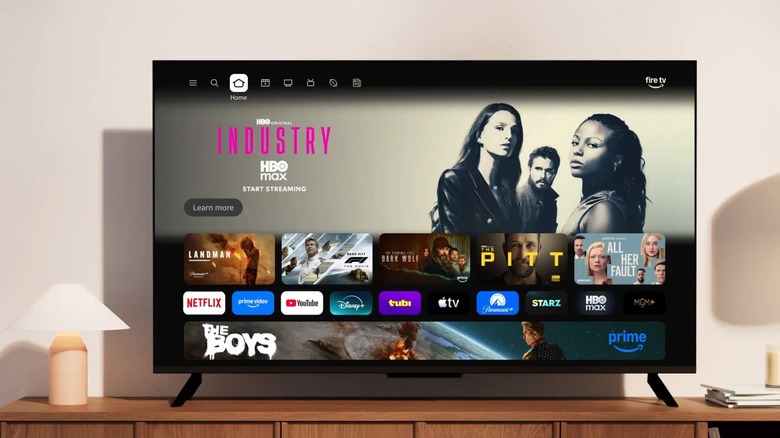 Amazon Fire TV Stick 인터페이스를 갖춘 스탠드 위의 TV.